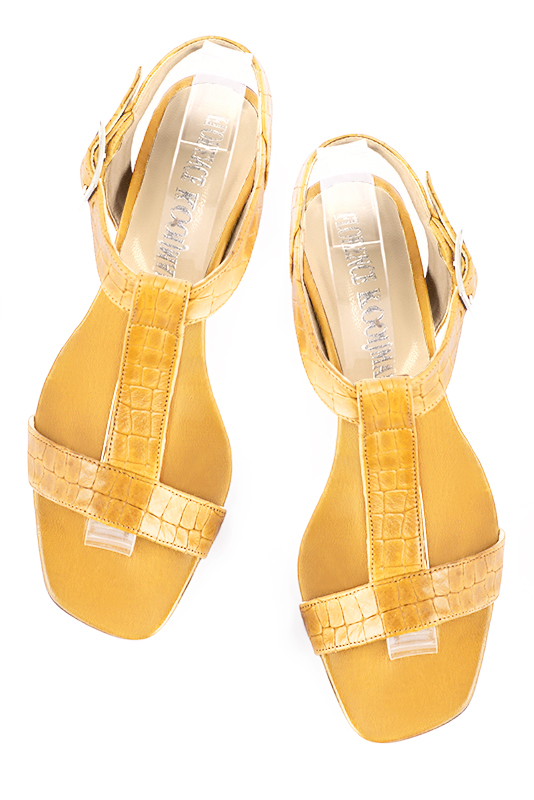 Mustard yellow women's fully open sandals, with an instep strap. Square toe. Low flare heels. Top view - Florence KOOIJMAN